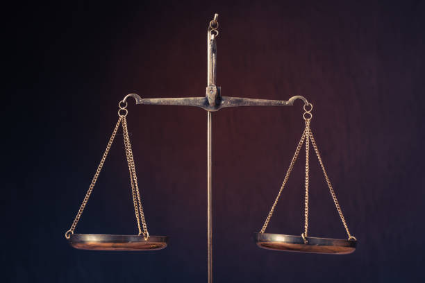 istock Law scales on table. Symbol of justice 1136110417