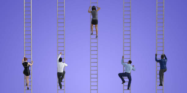 istock Business People Climbing Ladders 1136113389