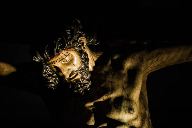 Jesus Christ crucified sculpture Jesus Christ crucified sculpture in wood isolated on black crucifix photos stock pictures, royalty-free photos & images