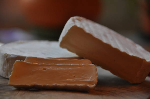 istock Cheese sliced on the board. Soft and fluffy. 1136116242