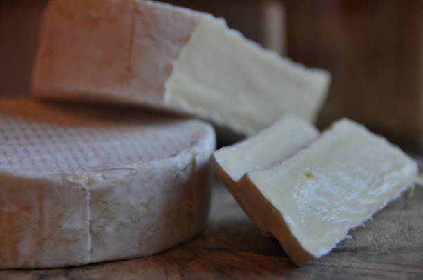 istock Cheese sliced on the board. Soft and fluffy. 1136116249