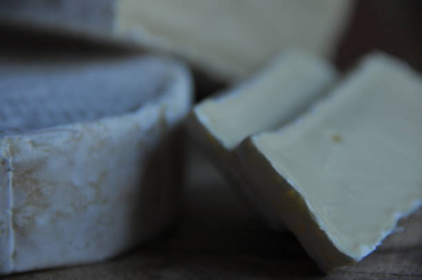 istock Cheese sliced on the board. Soft and fluffy. 1136116976