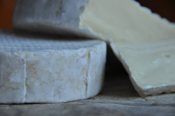 istock Cheese sliced on the board. Soft and fluffy. 1136117042