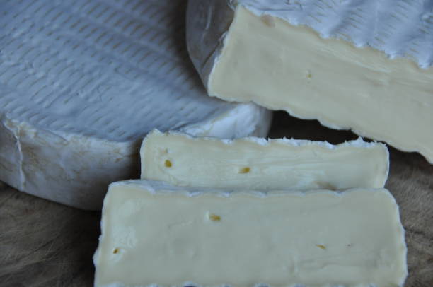 istock Cheese sliced on the board. Soft and fluffy. 1136117048
