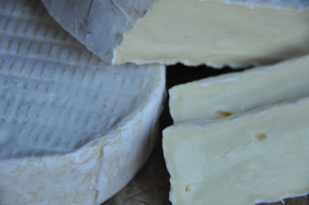 istock Cheese sliced on the board. Soft and fluffy. 1136117055