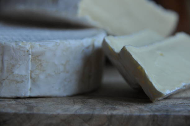istock Cheese sliced on the board. Soft and fluffy. 1136117056