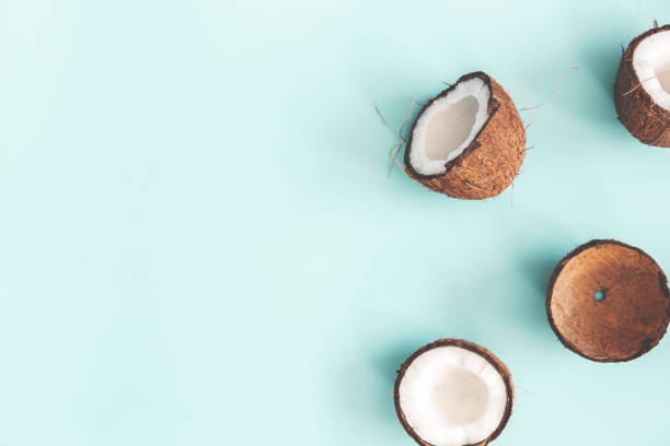 istock Summer composition. Coconut on pastel blue background. Summer concept. Flat lay, top view, copy space 1136117149
