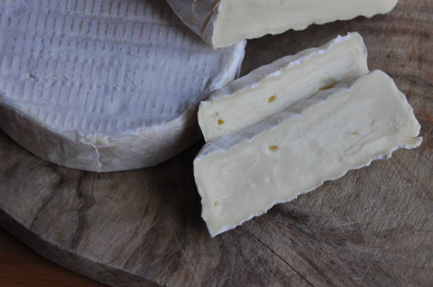 istock Cheese sliced on the board. Soft and fluffy. 1136117933