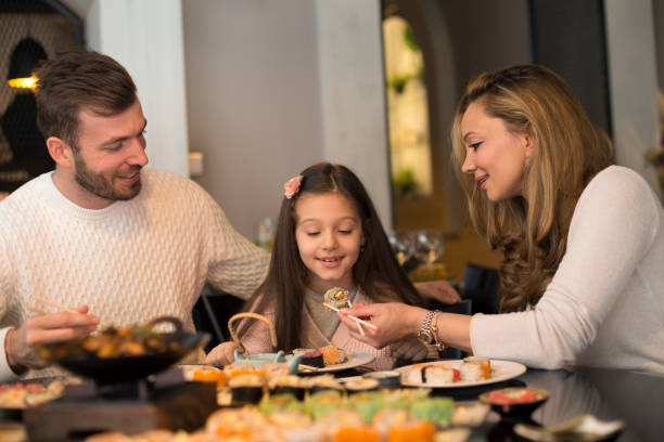 istock Family eating lunch 1136119738