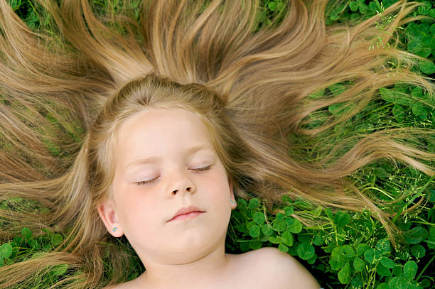 istock Little girl sunbathing 113612306