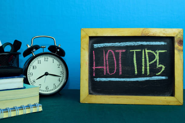 istock Hot Tips Planning on Background of Working Table with Office Supplies. 1136127442
