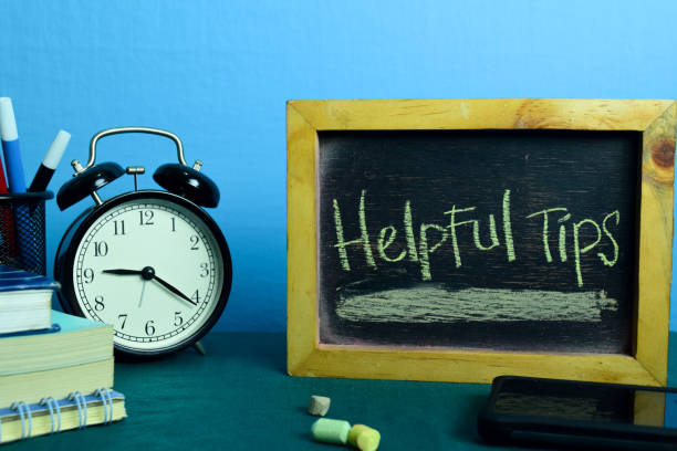 istock Helpful Tips Planning on Background of Working Table with Office Supplies. 1136128088