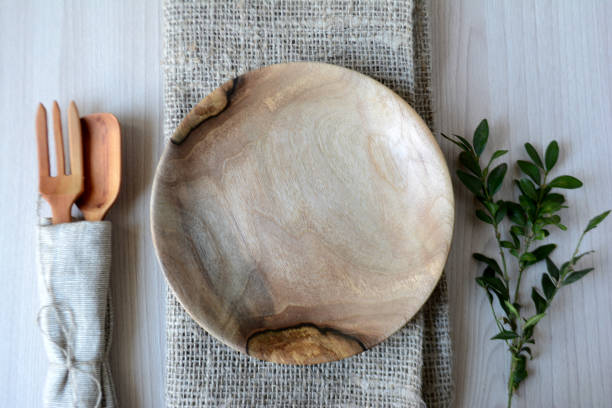 istock Empty wooden plate, fork and spoon on wooden table Serving table Top view 1136131947