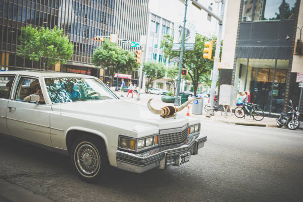 Austin, Texas, USA - May 22, 2017 : A old car with ox horn in the street.