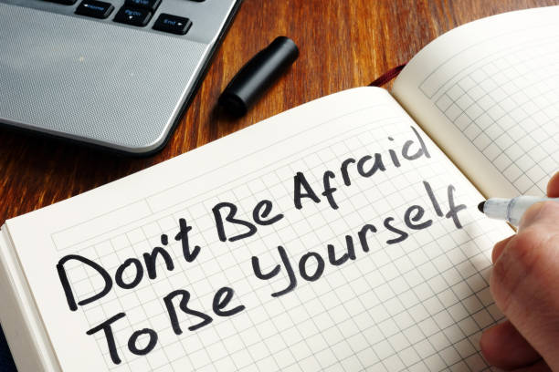 istock Dont be afraid to be yourself handwritten in a note. Motivation quote. 1136139333