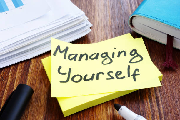 istock Managing yourself. Office table with papers. Self management concept. 1136139353