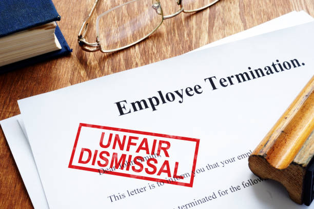 unfair dismissal stamp on the employee termination. - finishing employment issues occupation downsizing imagens e fotografias de stock