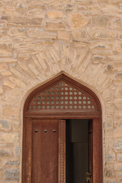 istock Oman ancient door to mosque 1136141453