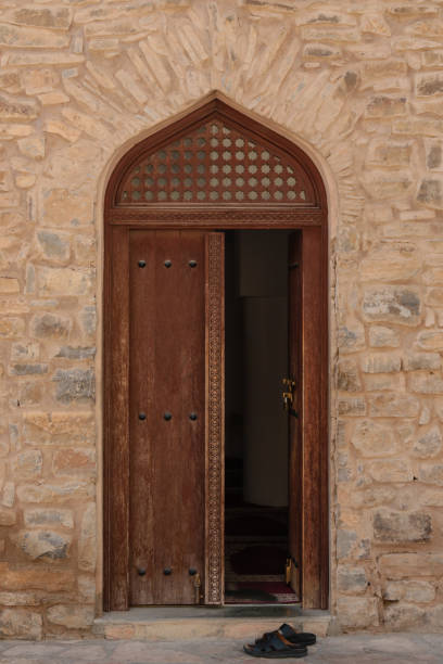 istock Oman ancient door to mosque 1136141622
