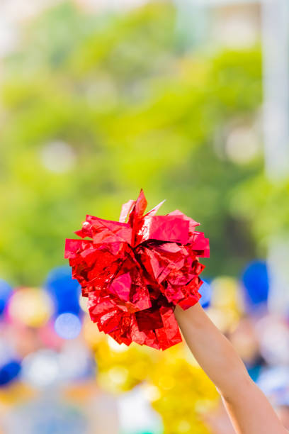 istock red cheerleader pom poms 1136142853