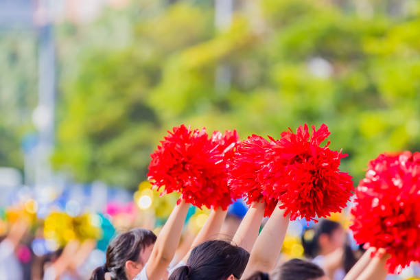 istock red cheerleader pom poms 1136142878