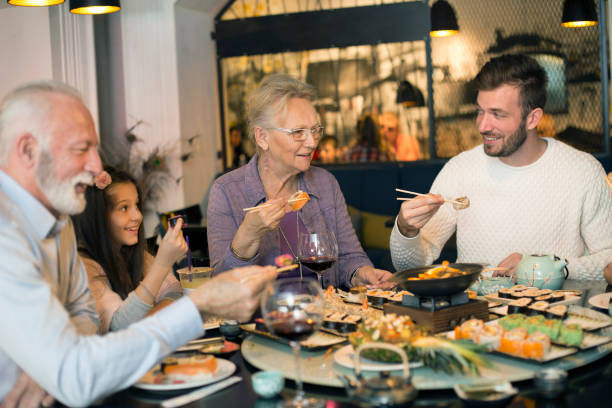 istock Family eating lunch in a restaurant 1136143565