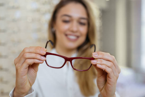 istock choosing glasses in optci store 1136145032