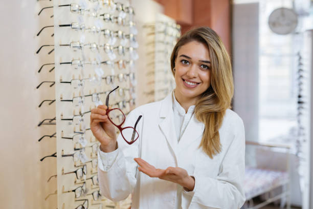 istock choosing glasses in optci store 1136145317