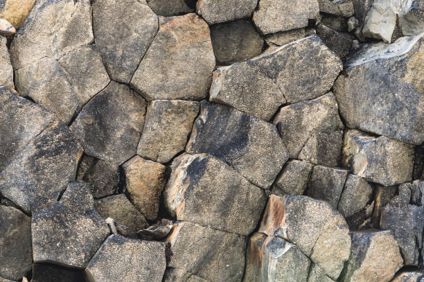 istock Textured basalt background hexagonal stone pillars in a section. natural volcanic formations 1136147337