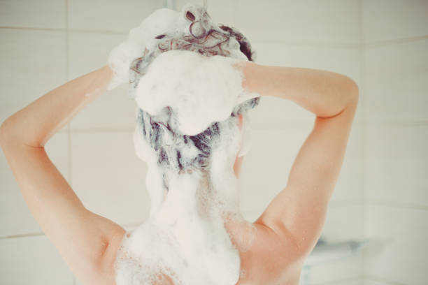 Woman washes her head