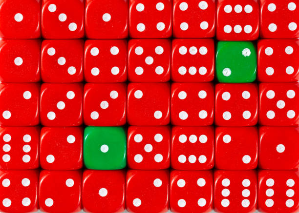 istock Background of random ordered red dices with two green cubes 1136147922