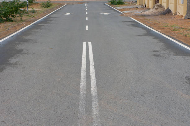 Open empty street in the desert. Conceptual. Nobody. Coming or going?