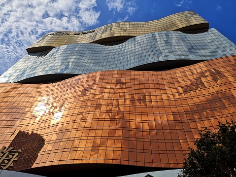 Low angle view of majestic MGM Macau facade, a 154 mt tall, 600-room casino resort in Macau peninsula.