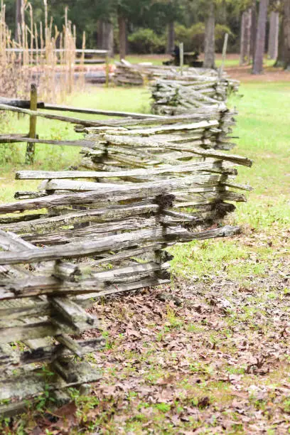 Photo of Rustic split rail fencing zig-zagging down through farm