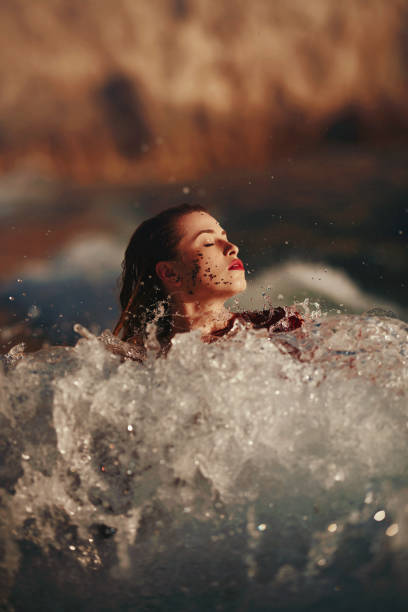 istock sexy woman in the waves 1136156231