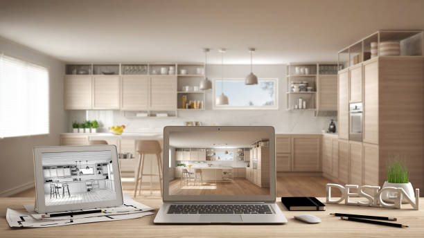 istock Architect designer desktop concept, laptop and tablet on wooden desk with screen showing interior design project and CAD sketch, blurred draft in the background, modern white kitchen 1136158149