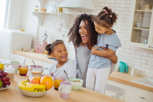 istock Positive delighted woman playing with her kids 1136159595