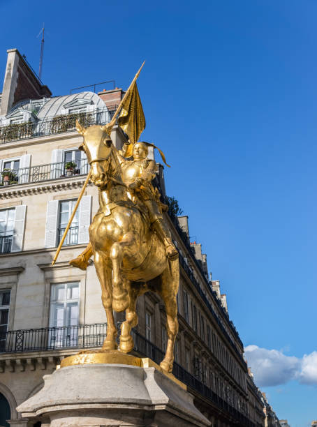 Statue of Joan of Arc on Place des Pyramides in Paris Paris, France - March 11 2019: Statue of (Joan of Arc Jeanne d'Arc in french) on Place des Pyramides in Paris. This gilded bronze equestrian sculpture was created in 1874 by Emmanuel Fremiet. place des pyramides stock pictures, royalty-free photos & images
