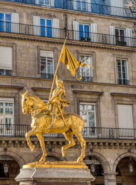 Statue of Joan of Arc on Place des Pyramides in Paris Paris, France - March 11 2019: Statue of Joan of Arc (Jeanne d'Arc in french) on Place des Pyramides in Paris. This gilded bronze equestrian sculpture was created in 1874 by Emmanuel Fremiet. place des pyramides stock pictures, royalty-free photos & images