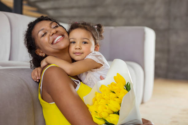istock Attractive brunette girl caressing her young mother 1136161586