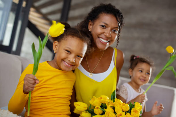 istock Positive delighted parent embracing her little kids 1136161593
