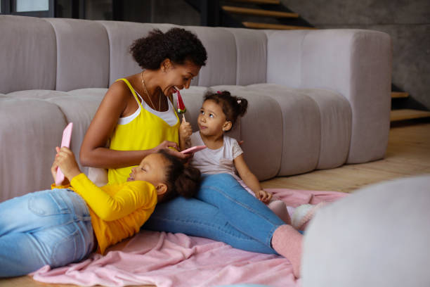 istock Positive delighted female testing candy of her daughter 1136161617