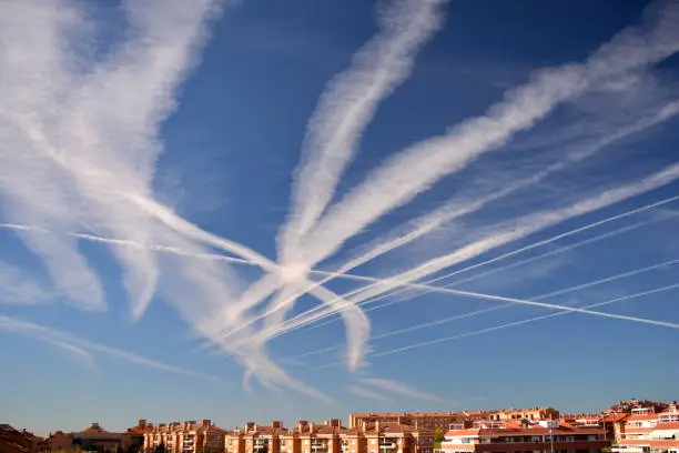 Believers in chemtrails say those trails are actually clouds of chemicals used by the government for nefarious purposes. In this case we can see a lot of contrials o may chemtrails over an european city
