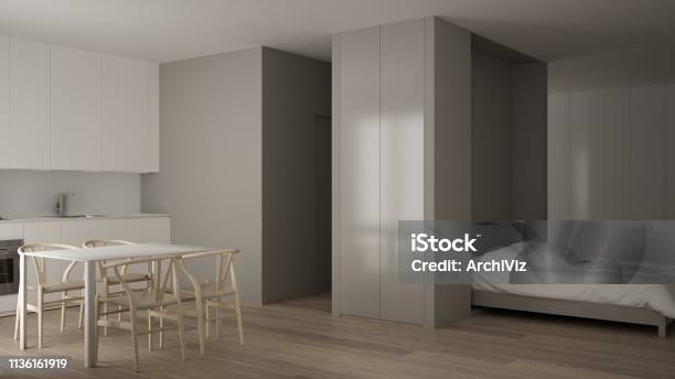 Small Apartment With Parquet Floor Kitchen In White Living Room Office In Minimalist Style Murphy Bed Rollaway Modern Architecture Concept Stock Photo - Download Image Now