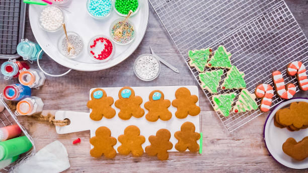 istock Decorating gingerbread and sugar cookies with royal icing for Christmas. 1136162872