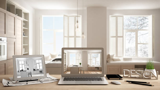istock Architect designer desktop concept, laptop and tablet on wooden desk with screen showing interior design project and CAD sketch, blurred draft in the background, modern white kitchen 1136163379