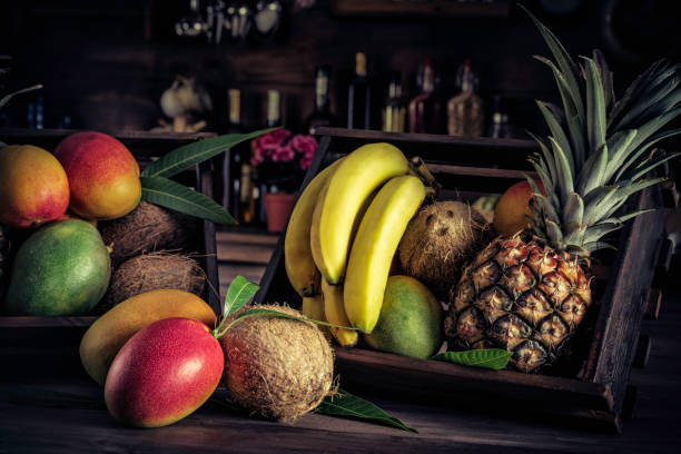 istock Wooden crates with assorted tropical fruits in rustic kitchen. Natural lighting 1136164765