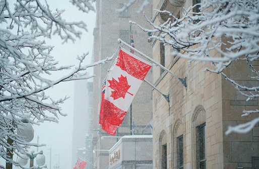 Canadian flag in front of a business building in Ottawa, Ontario, Canada