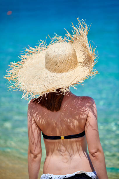 istock Woman in bikini on beach 1136167198
