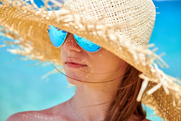 Woman in bikini on beach, Sithonia, Greece